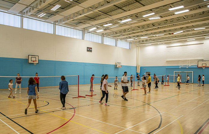 students-playing-badminton-sports-hall-berkshire-college